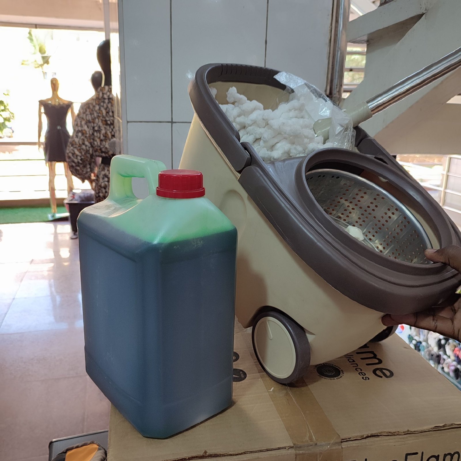 img_20241222_1439155947534366362491815.jpg Spin mopper with a pair of mopps and wheels with Free liquid soap 5liters - Image 1