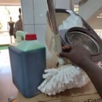 Spin mopper with a pair of mopps and wheels with Free liquid soap 5liters - Image 2